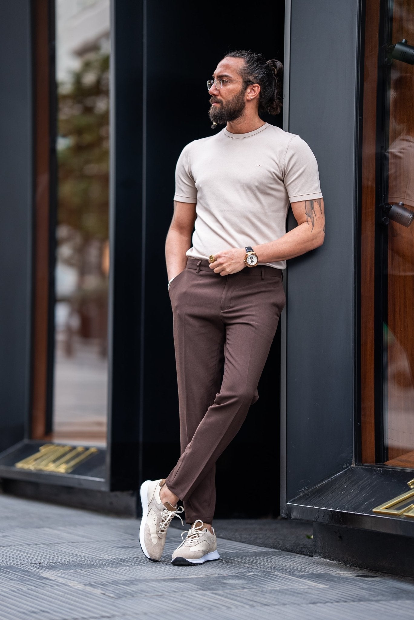 A Beige T-shirt worn by a model