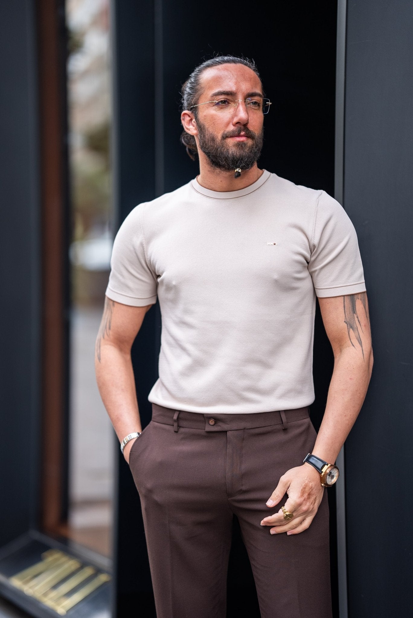 A Beige T-shirt worn by a model