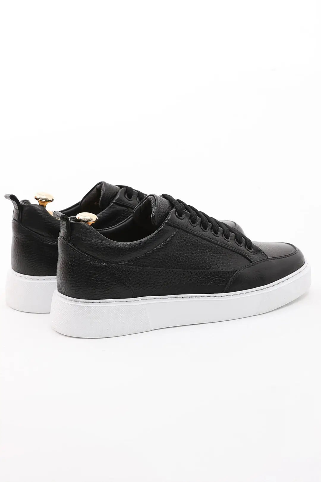 Black leather sneakers with white EVA sole. 