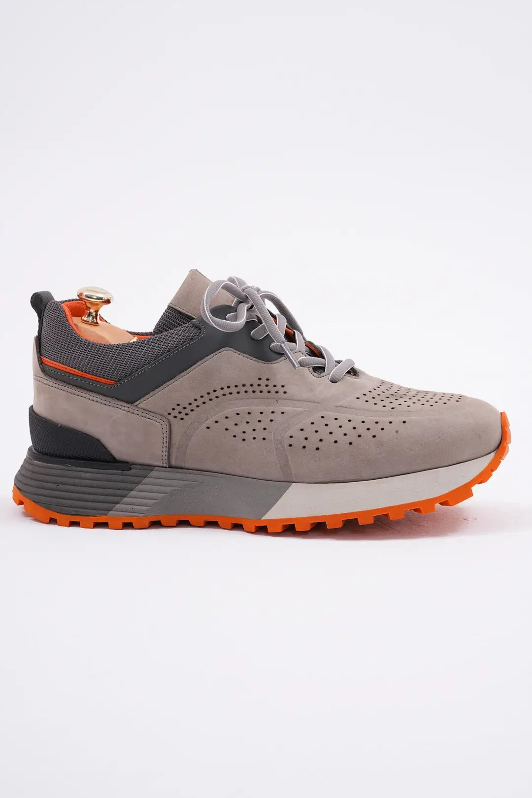 TrailBlaze Gray Leather Performance Sneakers with orange sole and perforated design.