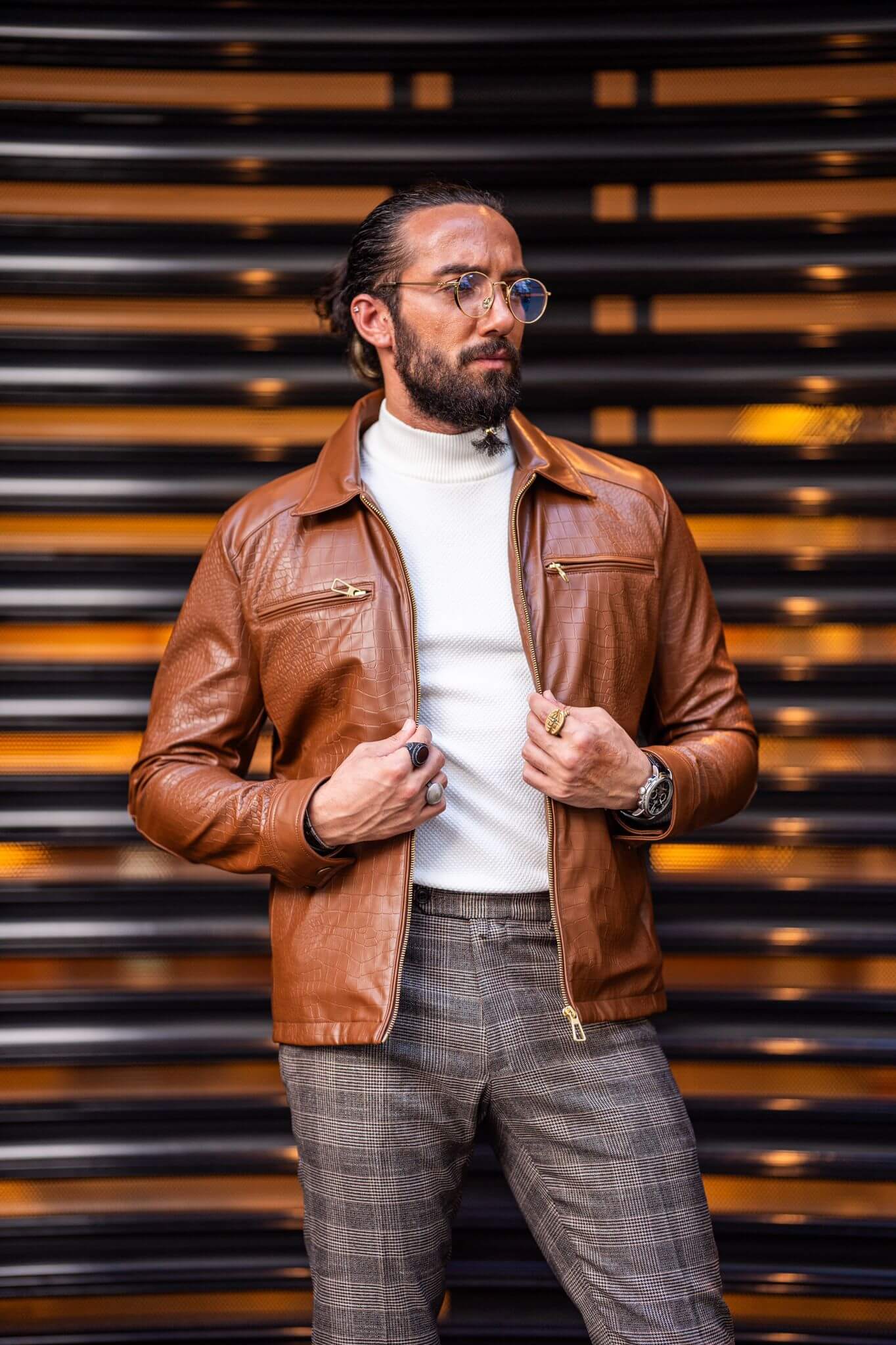 A Tan Leather Coat on display.