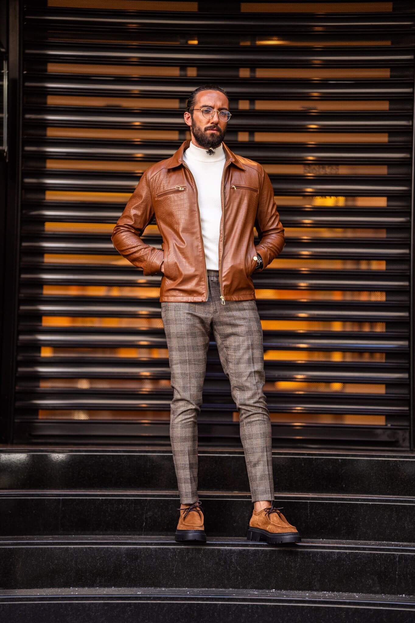 A Tan Leather Coat on display.