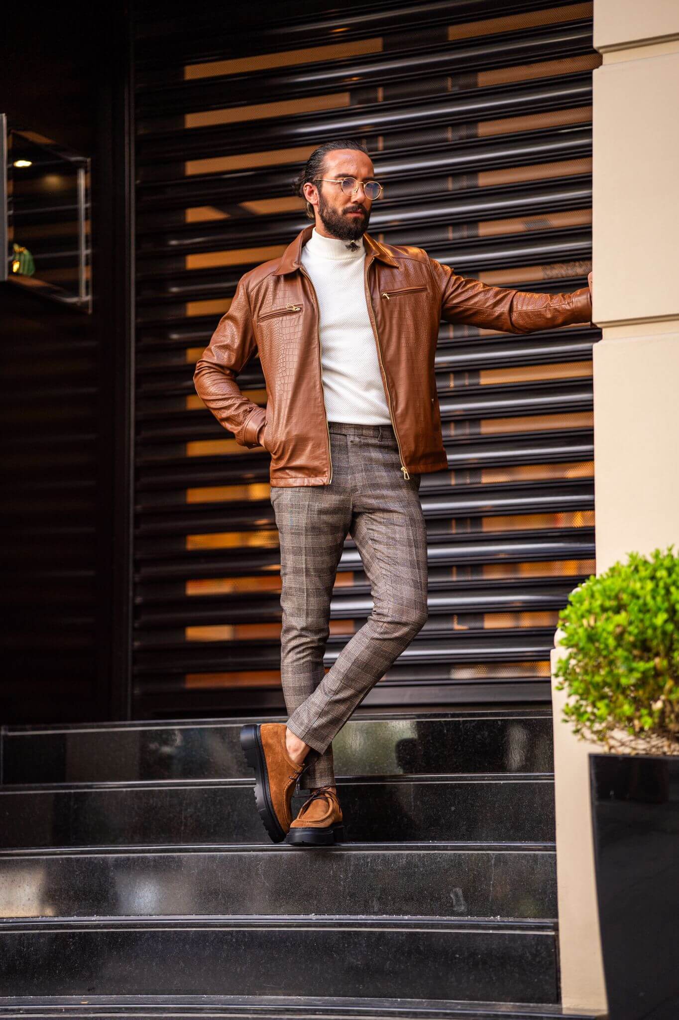 A Tan Leather Coat on display.