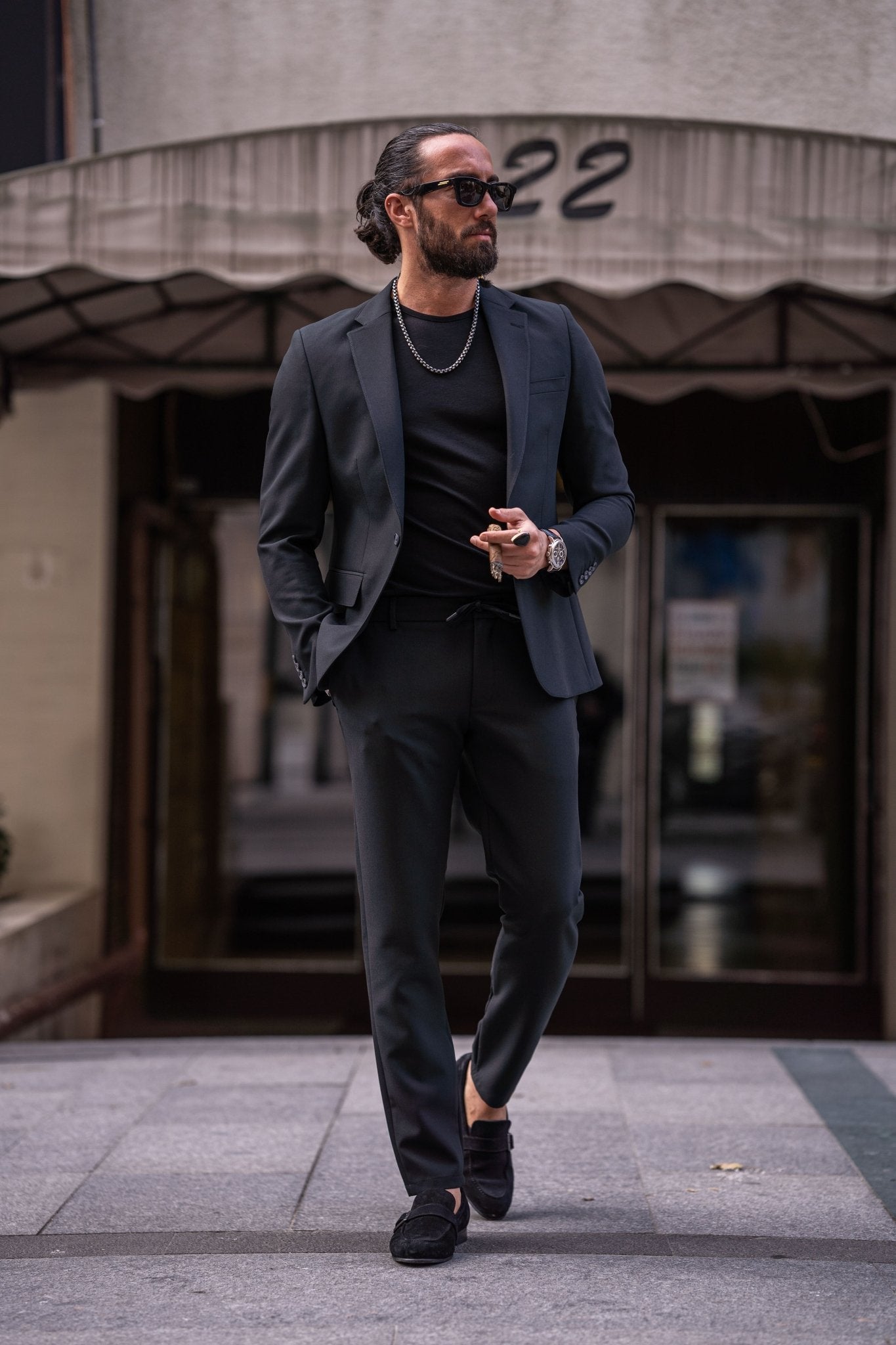 A Zambezi Black Sport Suit worn by a model