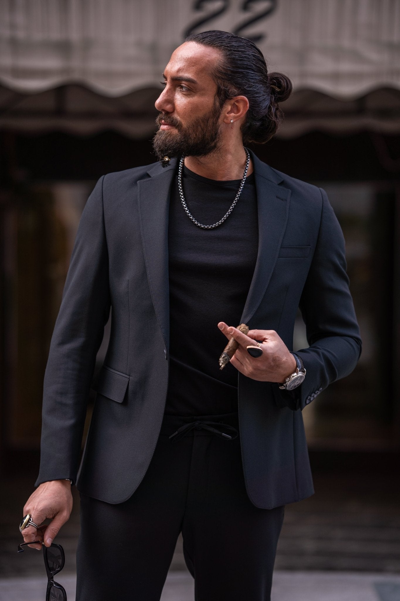 A Zambezi Black Sport Suit worn by a model